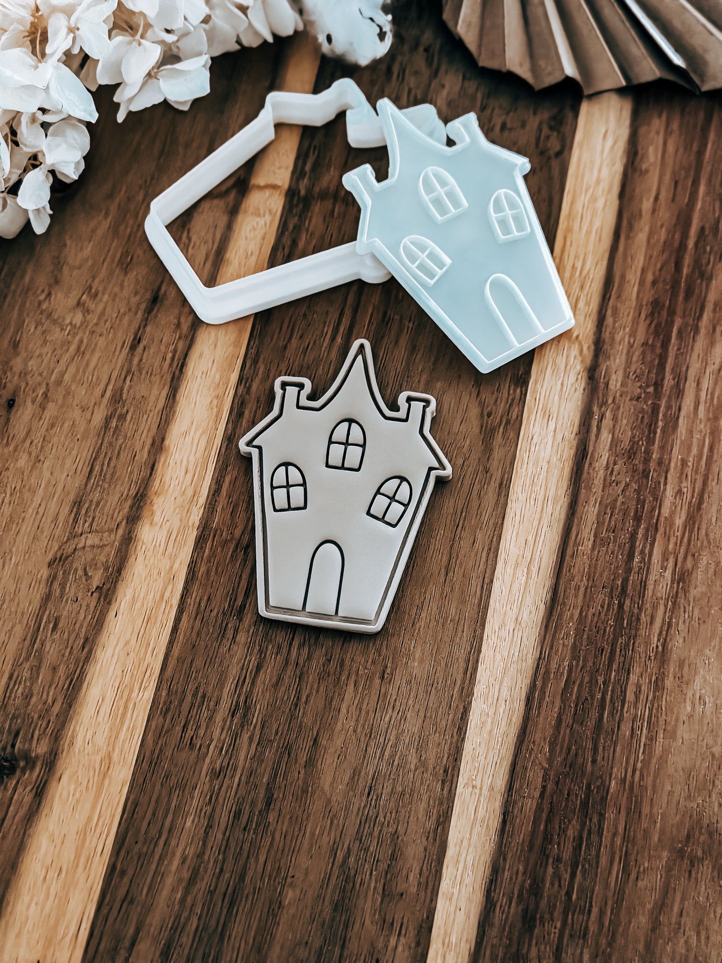Witch House Halloween cookie stamp and cutter by O'Khach, shown stamped in fondant