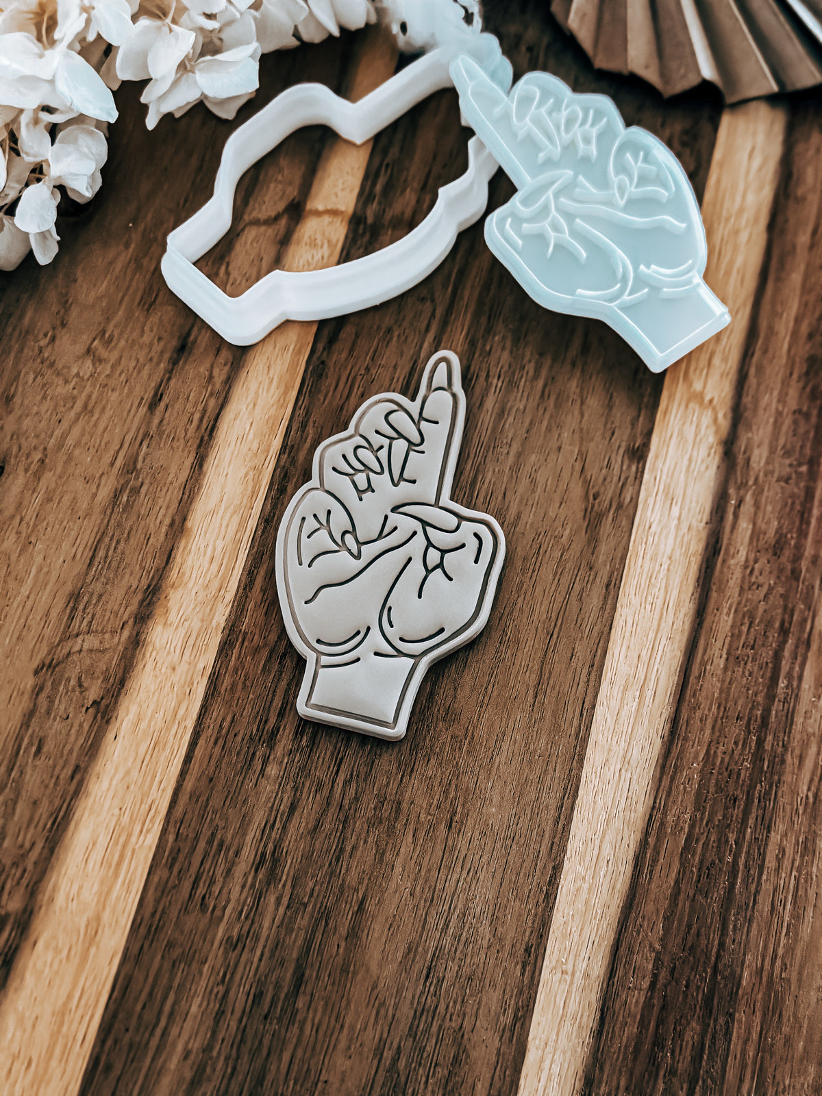 Witch Hand Halloween cookie stamp and cutter by O'Khach, shown stamped in fondant