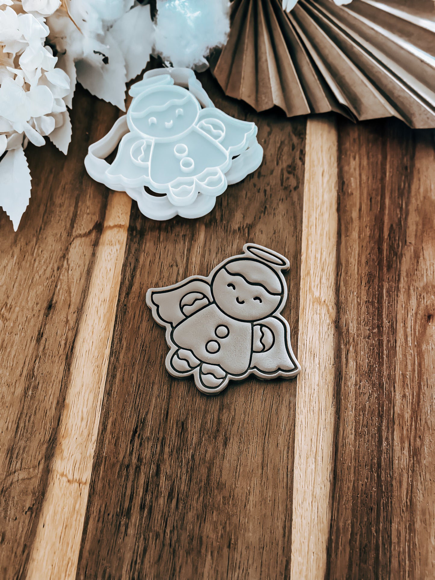 Gingerbread (Angel) Christmas cookie stamp and cutter by O'Khach, shown stamped in fondant