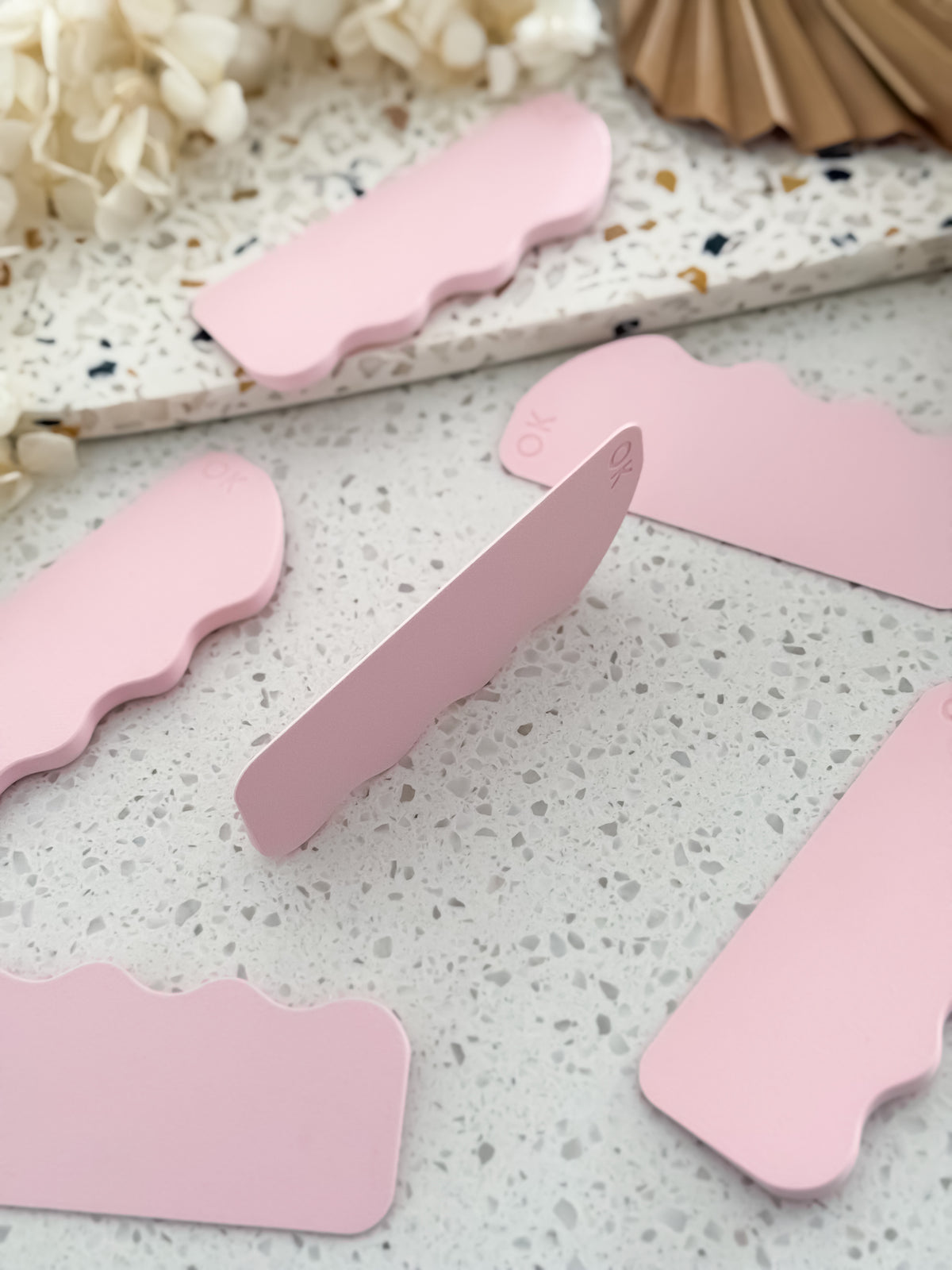 Scrape Pro™ standing on its edge, showing the slim scraping edge