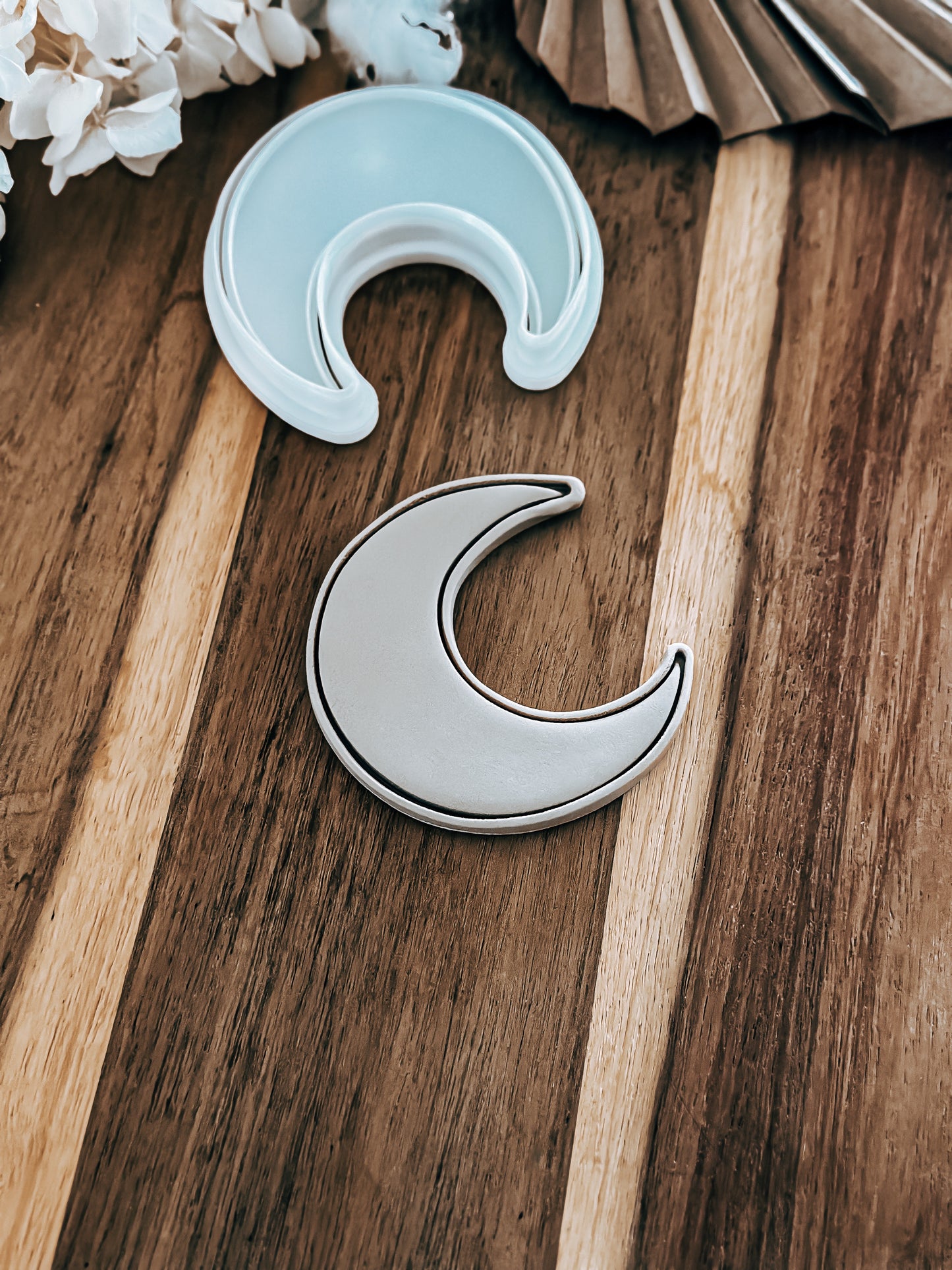 Half Moon Halloween cookie stamp and cutter by O'Khach, shown stamped in fondant