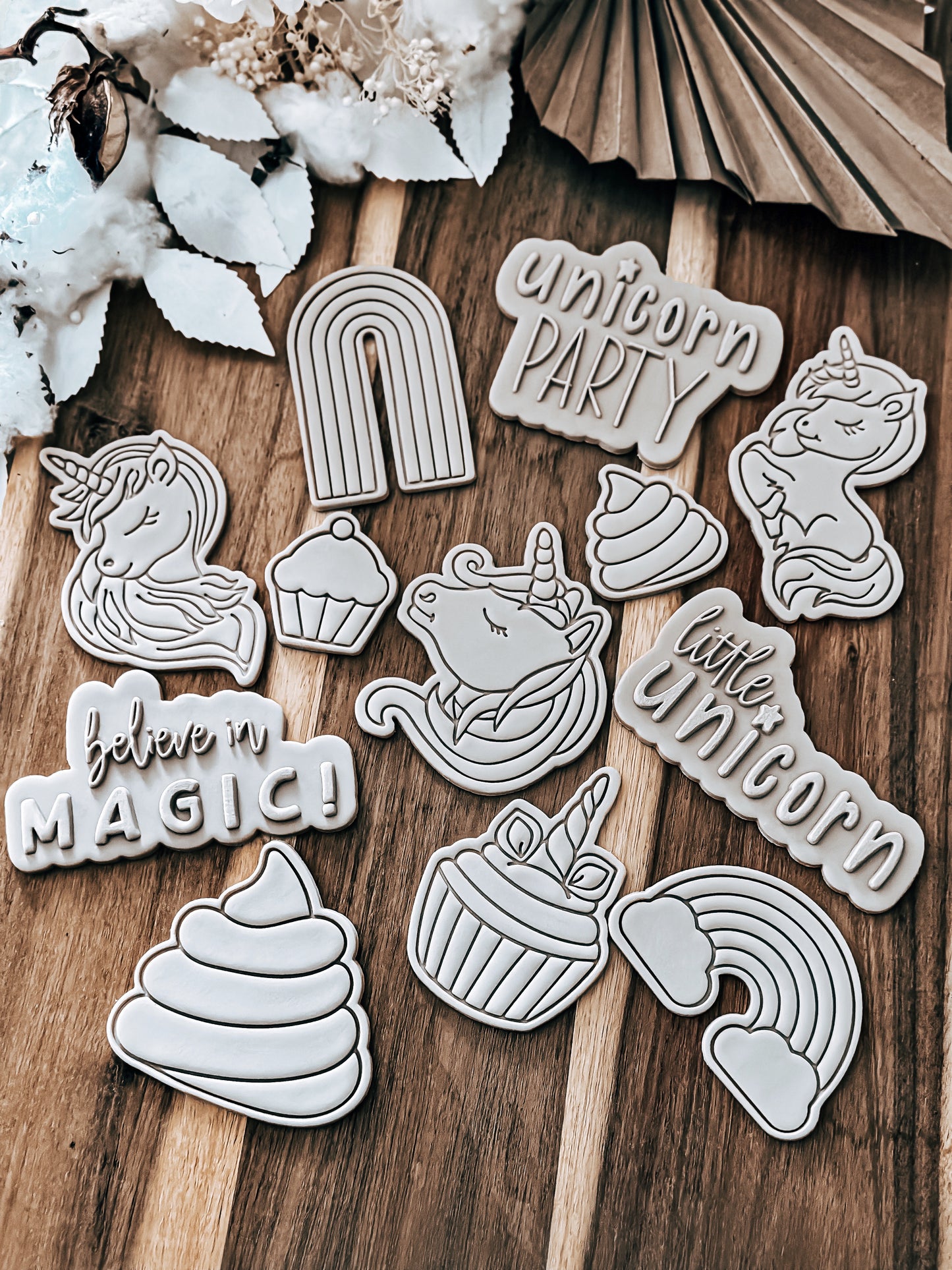 Rainbow design stamped in fondant to show the finished cookie