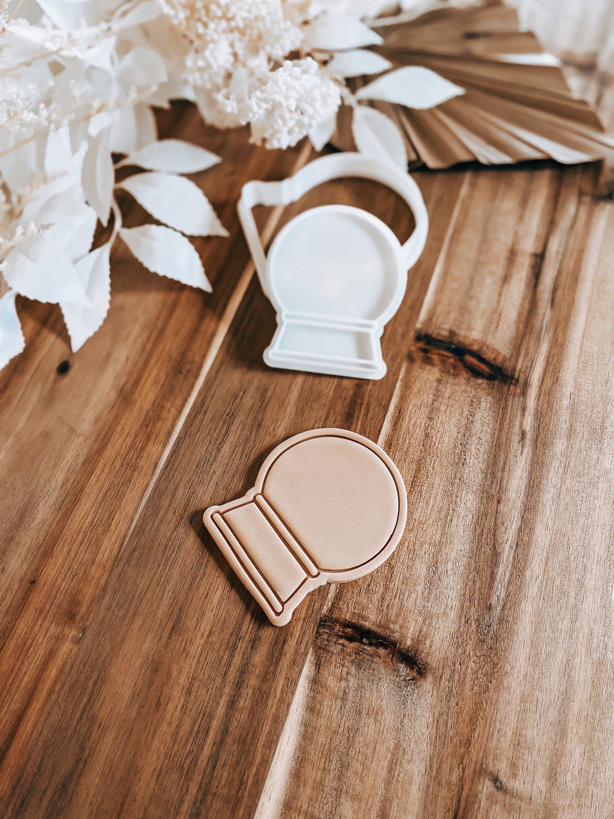 Snow Globe Christmas cookie stamp and cutter by O'Khach, shown stamped in fondant