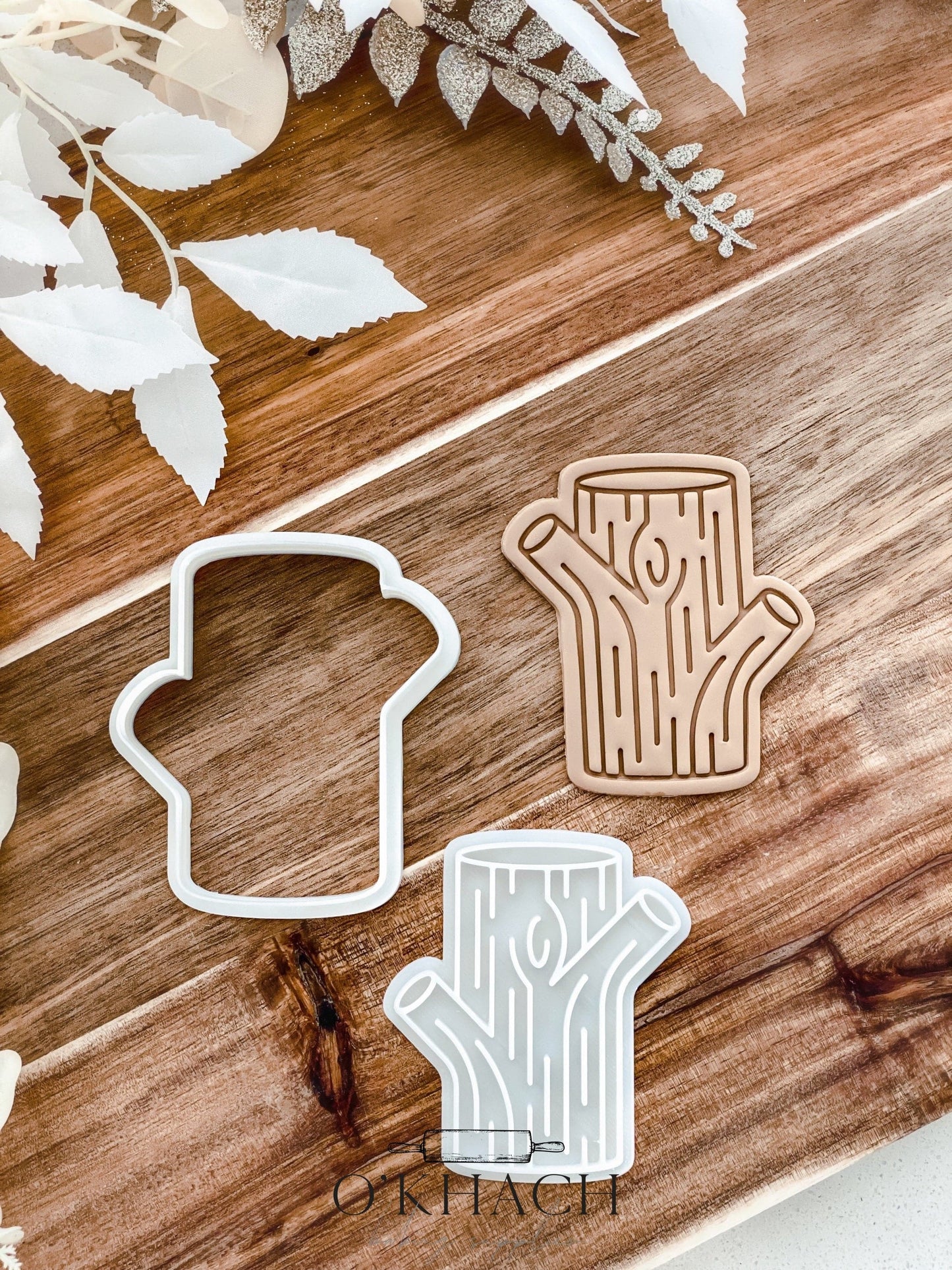 Tree Stump Christmas cookie stamp and cutter by O'Khach, shown stamped in fondant