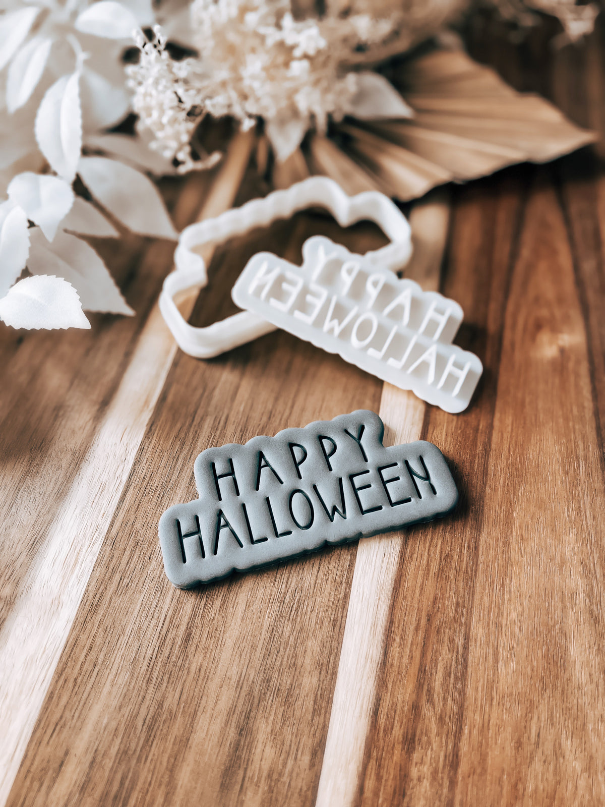 Happy Halloween cookie stamp and cutter by O'Khach, shown stamped in fondant