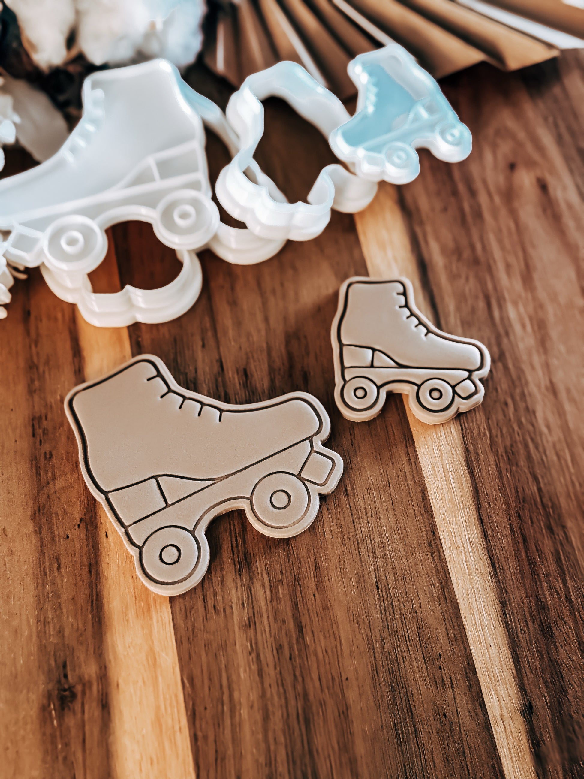 Roller skate cookie cutters on a wooden surface