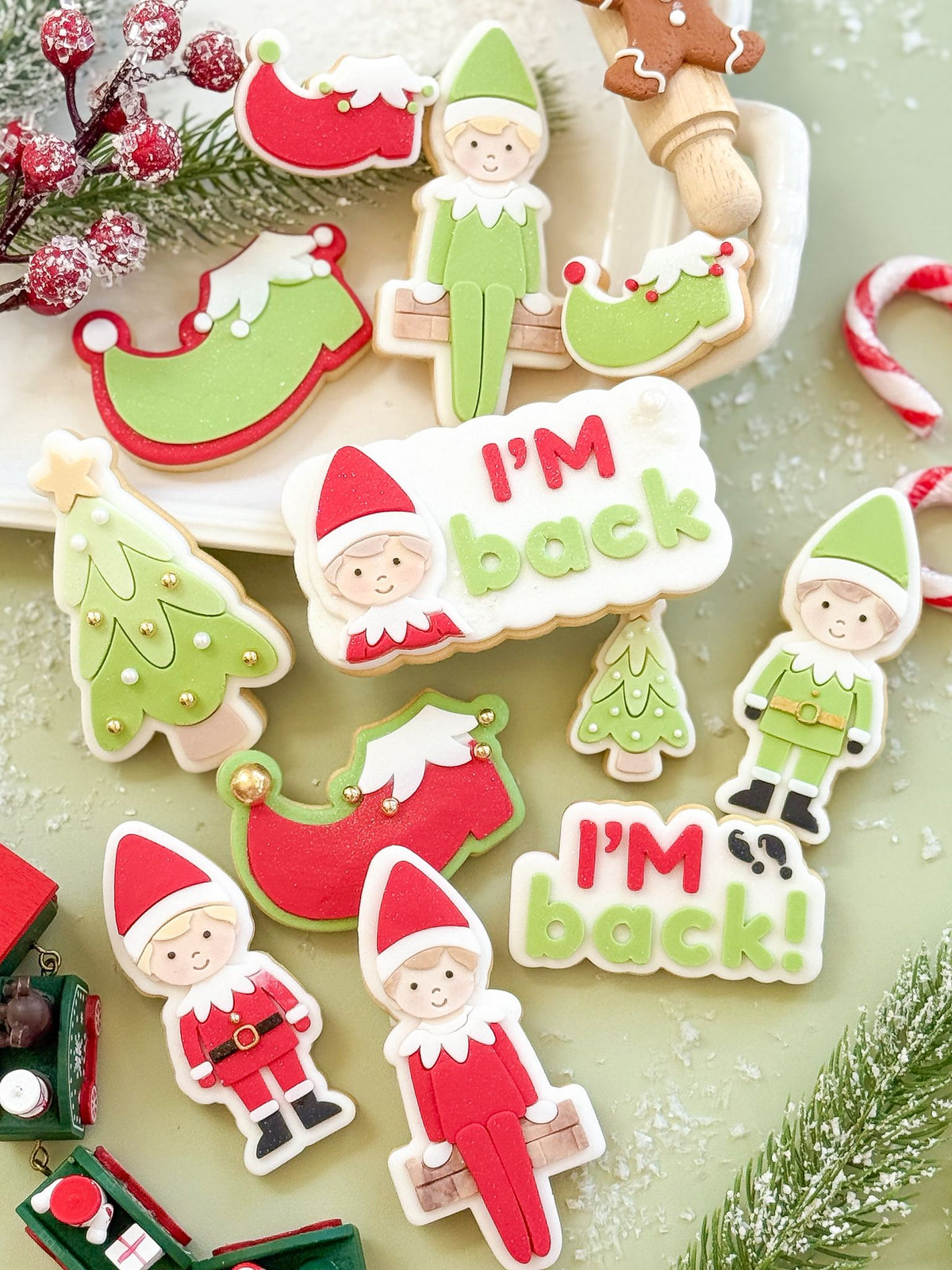 Elf fondant cookies with I'm back plaques and elf shoes